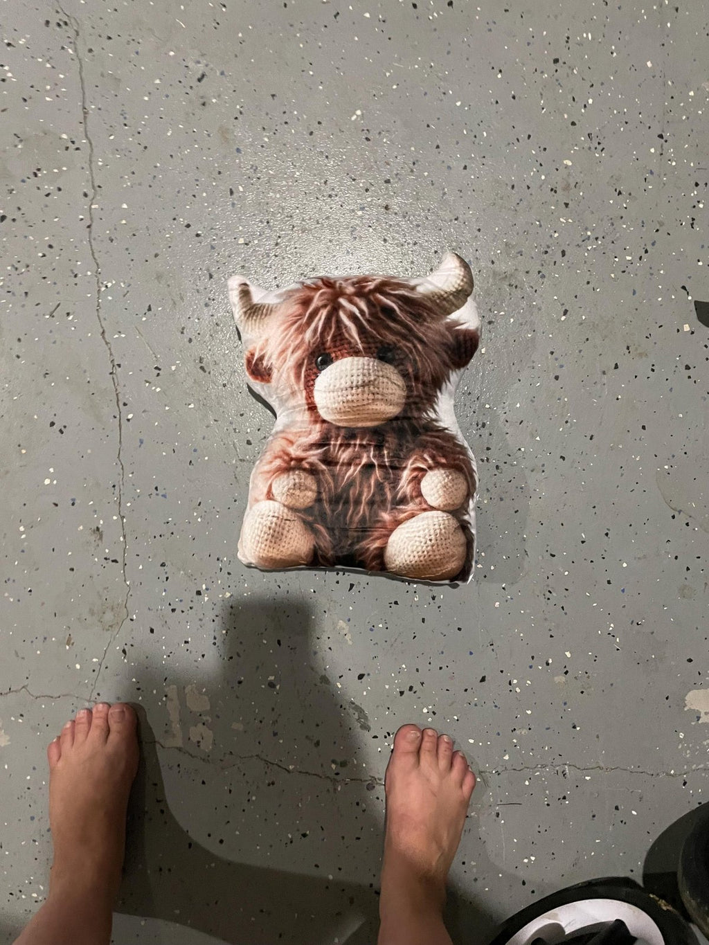 Real photo of the Highland Cow Faux Crochet Shaped Plush Pillow