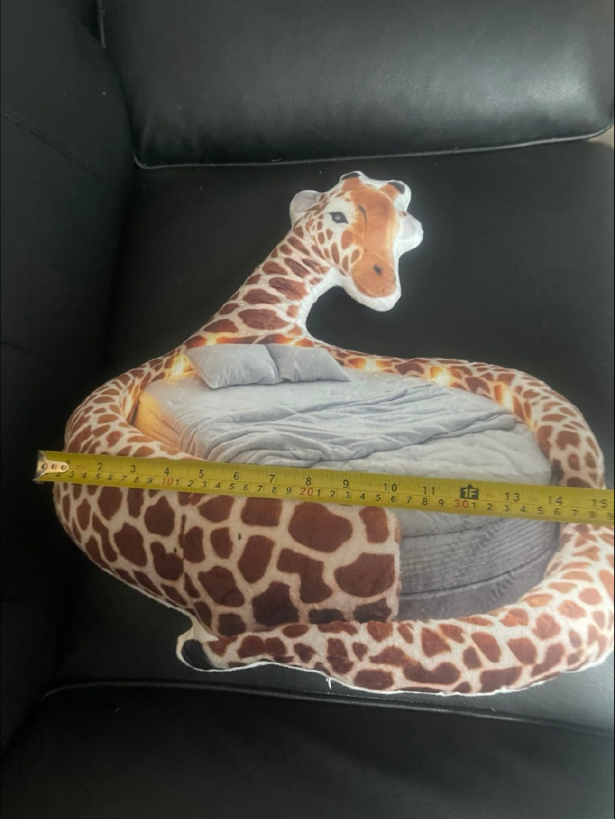 Customer photo of the Giant Giraffe flat plush shaped pillow