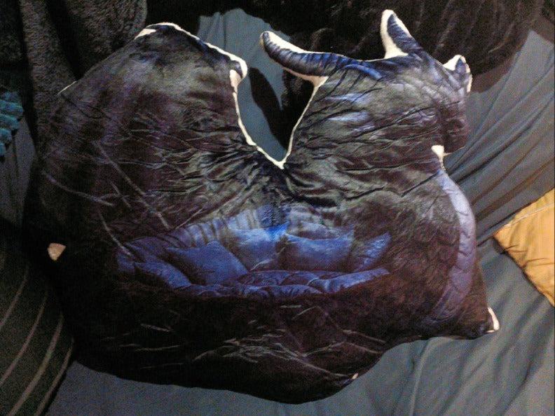 Customer photo (flagged for review) of the Giant Midnight Dragon flat plush shaped pillow