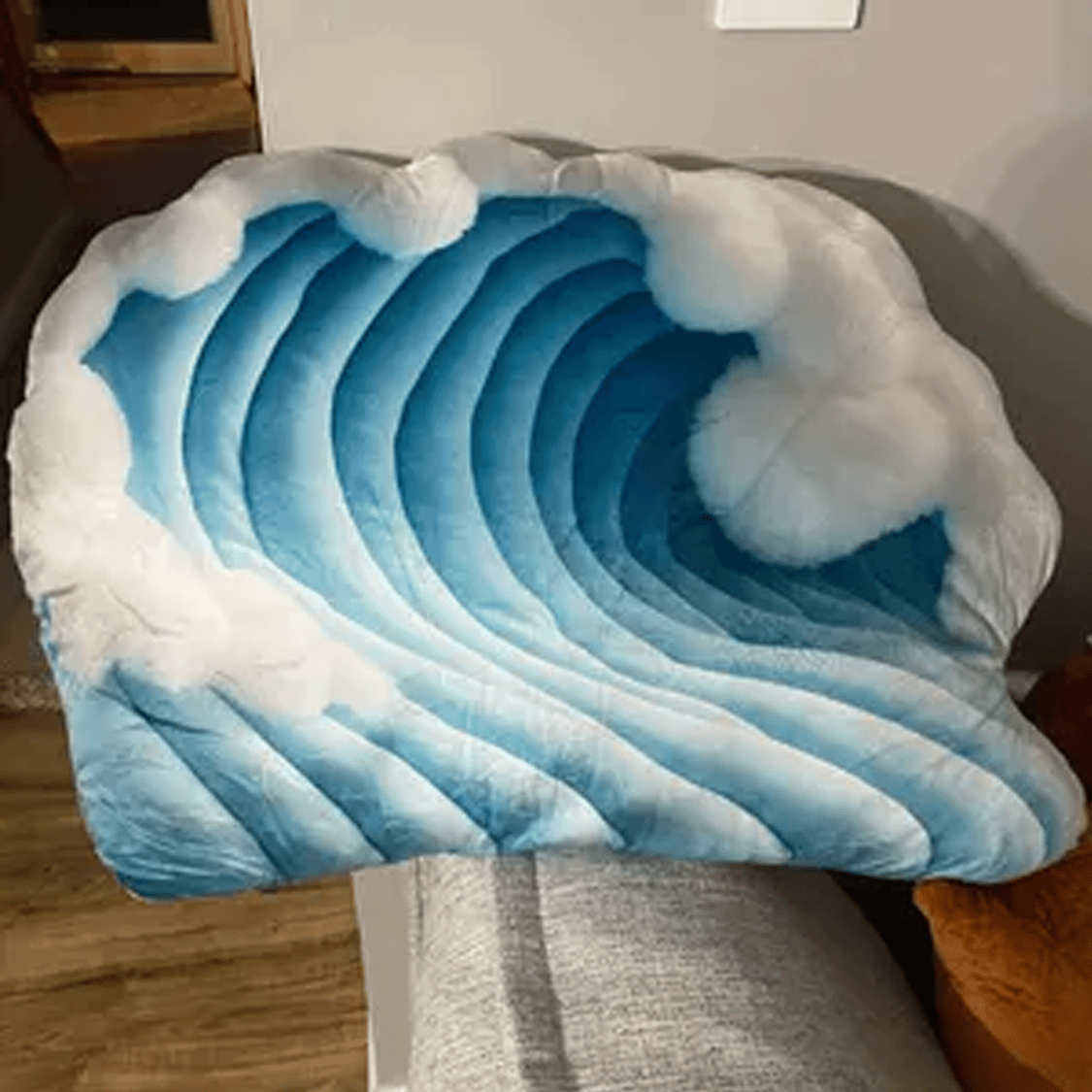 Real photo of the Ocean Wave Plush Shaped Pillow