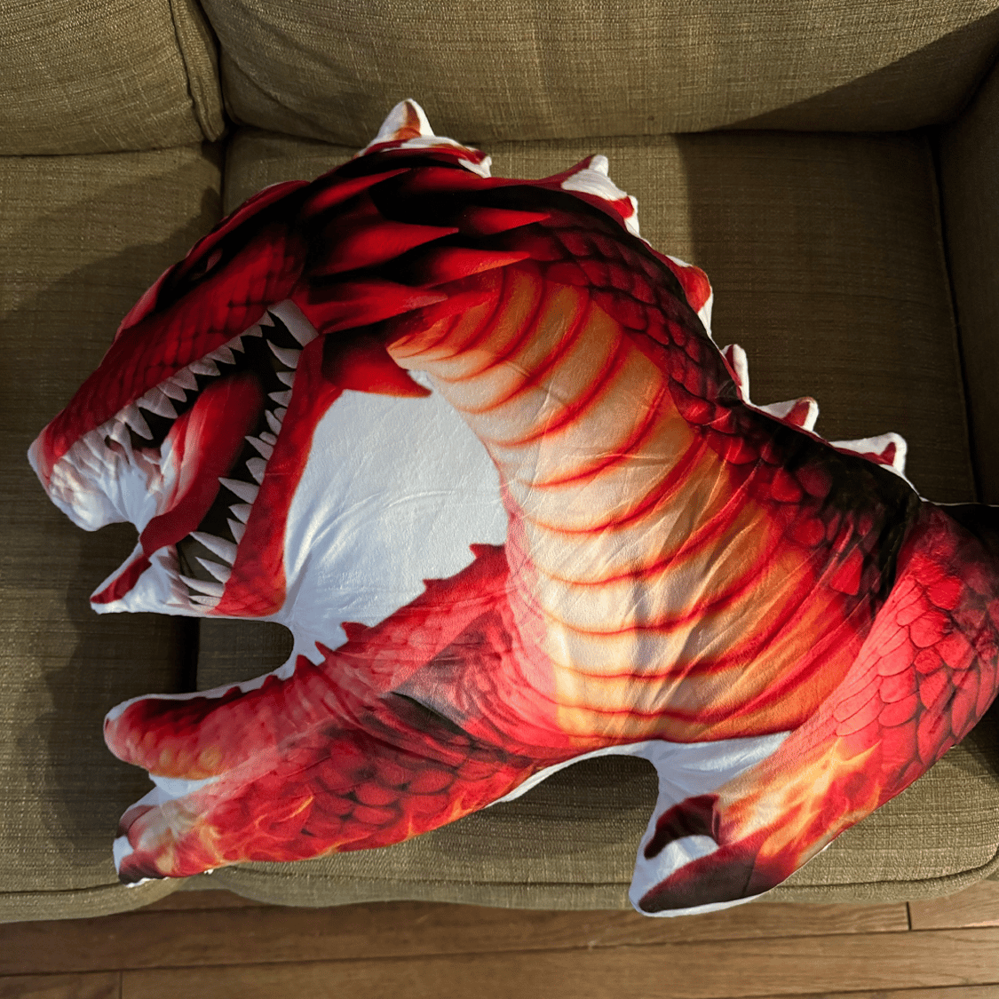 Real photo of the Red Fire Dragon Shaped Plush Pillow